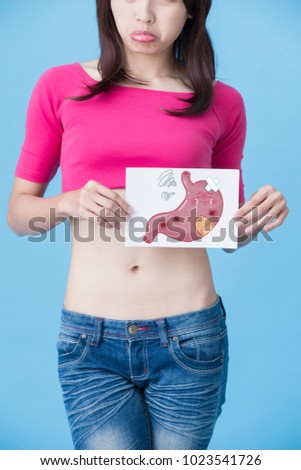 woman with sick stomach concept on the blue background