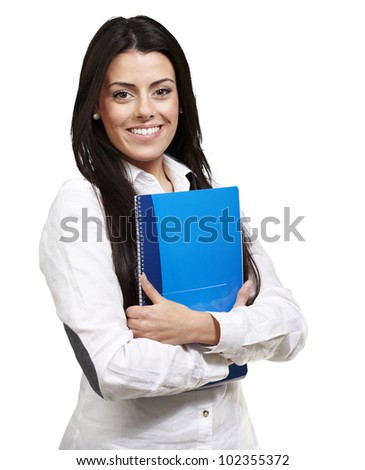 young woman smiling and holding a notebook against a white background