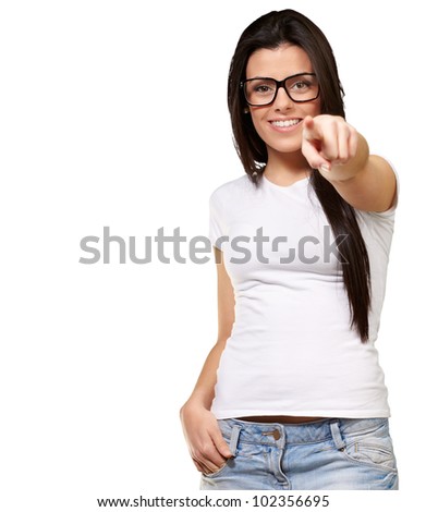 portrait of a young woman pointing with her finger against a white background