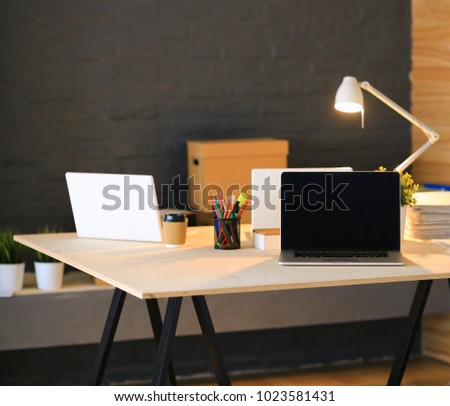Office workplace with laptop and on wood table