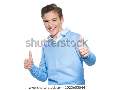 Photo of teenage boy with thumb up - looking at camera. 
