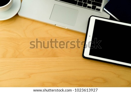 desk,working space. Laptop, notepad on wooden desk computer on vintage wooden table