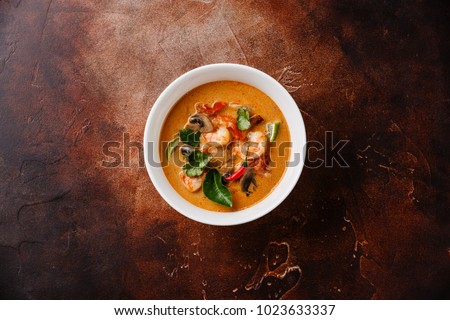 Tom Yam kung Spicy Thai soup with shrimp, seafood, coconut milk and chili pepper in bowl copy space Royalty-Free Stock Photo #1023633337