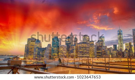 New York. Wonderful Manhattan skyline at sunset from Brooklyn Bridge.
