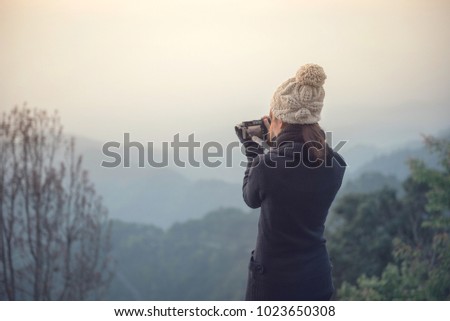 Traveler woman take photo view of mountain .