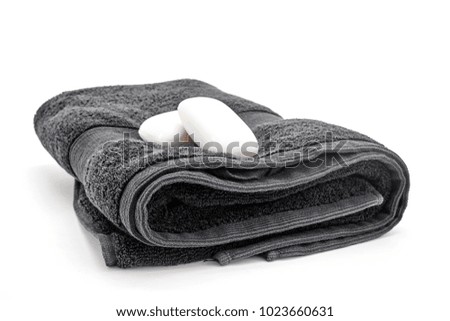 A studio photo of a black bathing towel