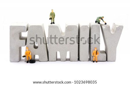 family word from cement letters and worker figure