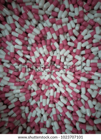pink and white capsules