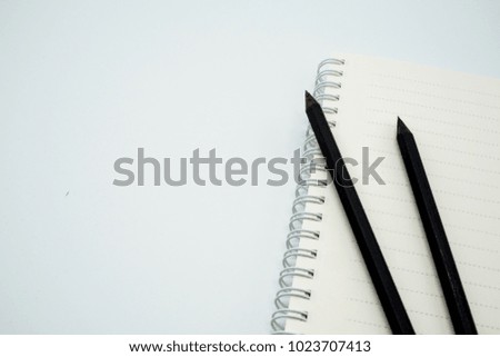 Black Pencil and notebook isolated on white background : concept of creative , idea, concept, corporate