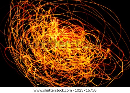Orange Color Light Painting Photography Over Black Background