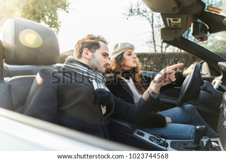 couple inside car indicate, woman drive cabriolet car, collaboration concept