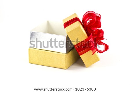 Opened gift box and red ribbon on white background
