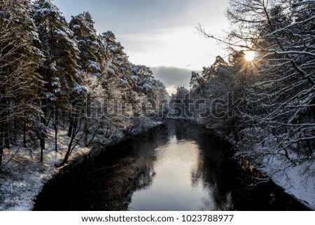 Winter landscape with a small river