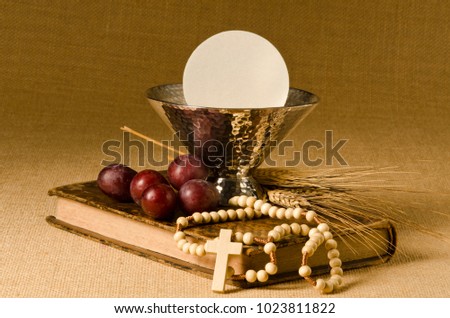 First Holy Communion composition on beige sackcloth background.