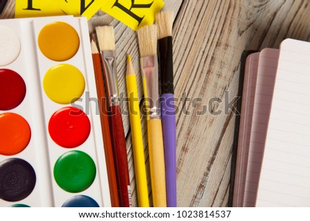 Stationery on grey wooden background