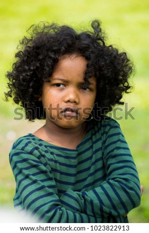 Portrait of little boy feeling sad and boring face