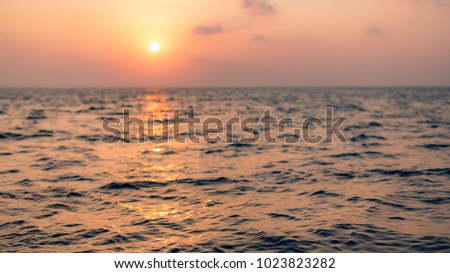 Beautiful sunset sky and abstract sea and sun rays. Inspirational summer nature background, ocean waves and soft sunlight