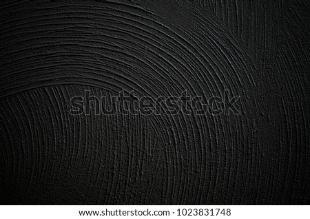 Pattern on the surface of the cement wall.Black cement floor is not smooth.To make a background image.copy space