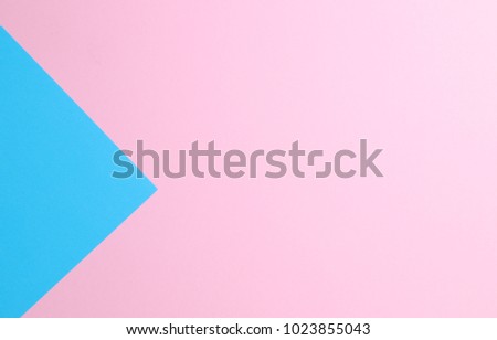 Blue and pink pastel color papers geometric flat laying as background  and template.