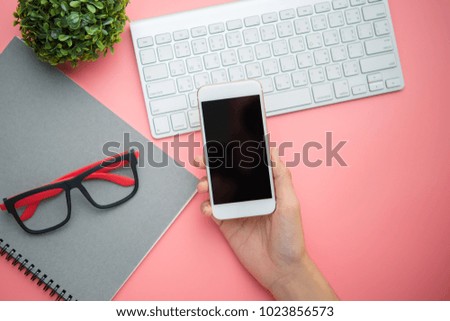 Hand Using Smartphone keyboard on top view