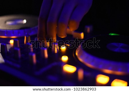 Pro DJ on cool turn tables low light shoot