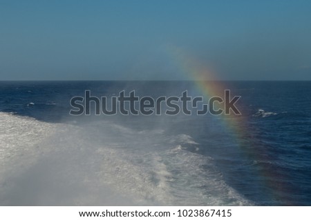 Wake and rainbow left by a ship. Atlantic ocean. Canary Islands. Spain.