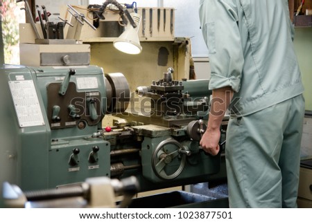 People working at a town factory Royalty-Free Stock Photo #1023877501