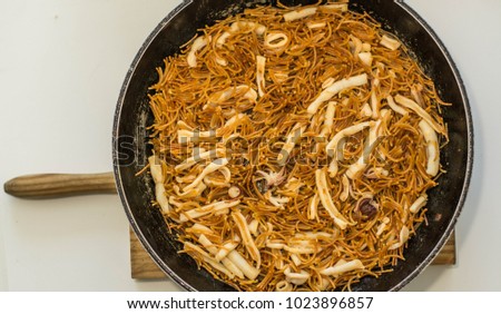 Spanish fideua, a typical noodles casserole, the noodle paella, 