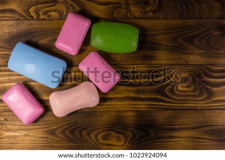 Set of colorful soap on wooden background