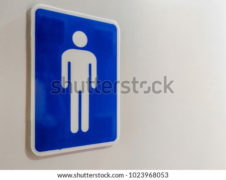 Male toilet sign on wooden door. with copy space for text.