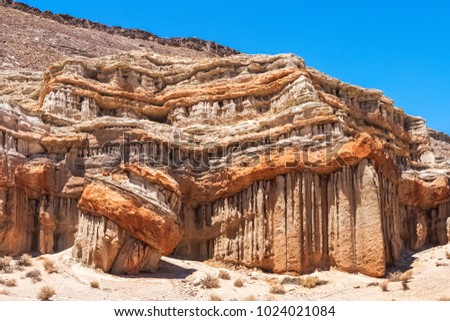 Geological rock formation in the Red Cliffs Natural Preserve, Red Rock Canyon State Park, California, summer. Royalty-Free Stock Photo #1024021084