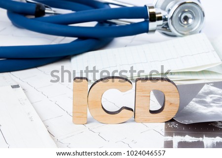 ICD Acronym or abbreviation to implantable cardioverter defibrillator as device that monitors heart rhythm problems. Word ICD is around ECG paper strips, result of echocardiography and stethoscope 