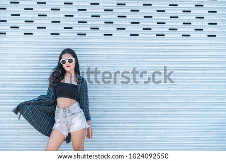 Portrait of beautiful asian woman,Hipsters girl for take a picture outdoor,Thailand people stand on stair
