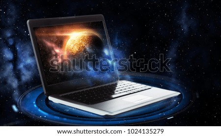 astronomy and future technology concept - laptop computer with virtual planet and space hologram