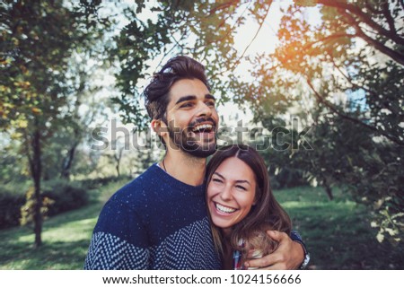 Young couple in love having fun and enjoying the beautiful nature