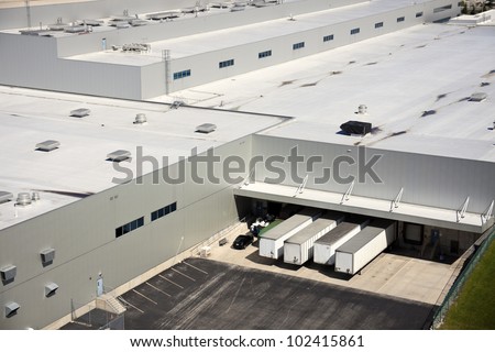 Loading docks in the industrial area - aerial photo Royalty-Free Stock Photo #102415861