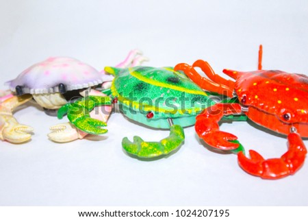 Red crab toy on white background
