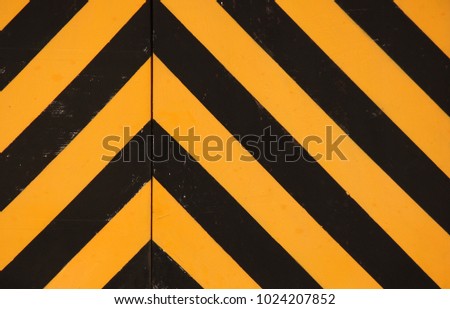 BLACK AND YELLOW PAINTED CHEVRON PATTERN
