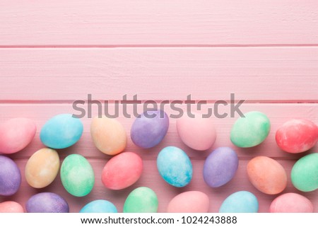 Pink pastel Easter eggs background. Spring greating card.