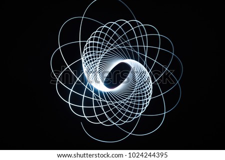 light spiral on a black background Royalty-Free Stock Photo #1024244395