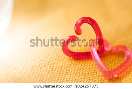 Two heart (red and pink) on the canvas and blurred background,Valentine day concept.