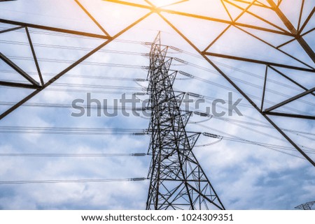 Electricity concept, Close up high voltage power lines station.  High voltage electric transmission pylon silhouetted  tower.