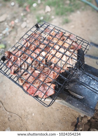 Fresh grilled meat.grilled meat skewers, barbecue. Grilled beef steak medium rare on wooden cutting board. Top view.