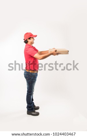 Indian/Asian Handsome Delivery Man with Box, isolated over white background