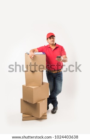 Indian/Asian Handsome Delivery Man with Box, isolated over white background