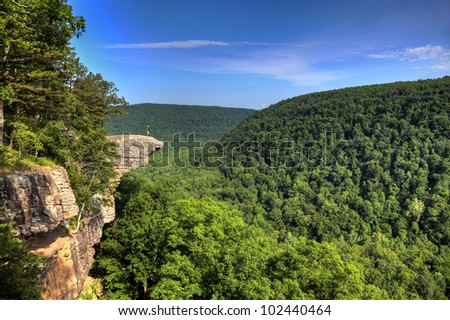 Hiker on the famous Hawksbill Crag in Arkansas. Royalty-Free Stock Photo #102440464