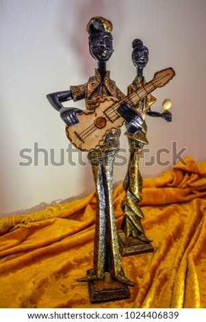 statuettes of Cuban women and men a souvenir of wood Royalty-Free Stock Photo #1024406839