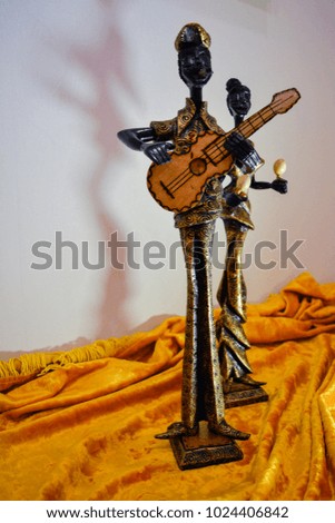 statuettes of Cuban women and men a souvenir of wood Royalty-Free Stock Photo #1024406842