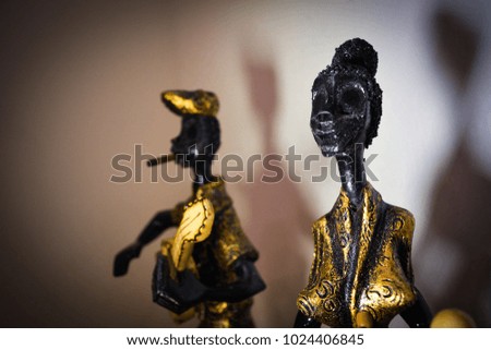statuettes of Cuban women and men a souvenir of wood Royalty-Free Stock Photo #1024406845