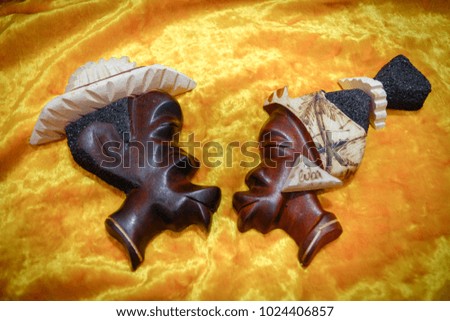 kissing the heads of Cuban women and men a souvenir of wood Royalty-Free Stock Photo #1024406857
